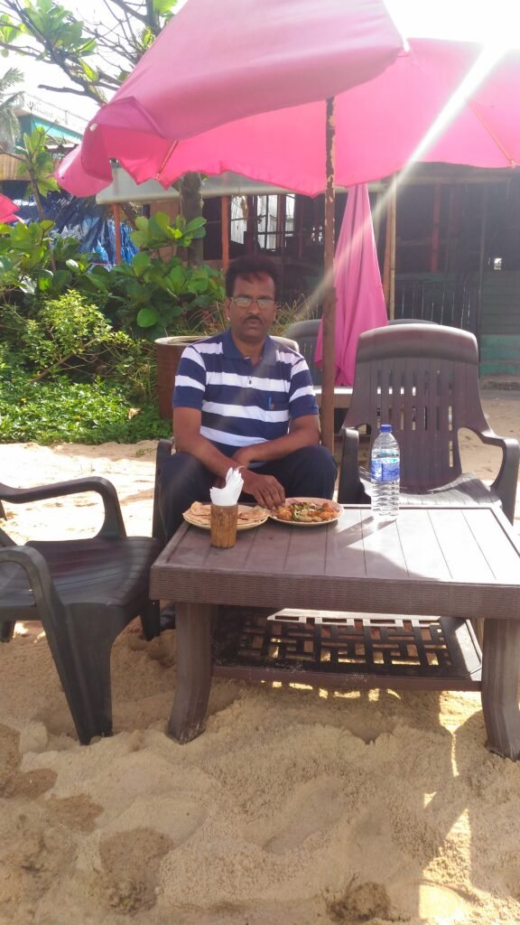 Enjoying local cuisine at Candolim Beach